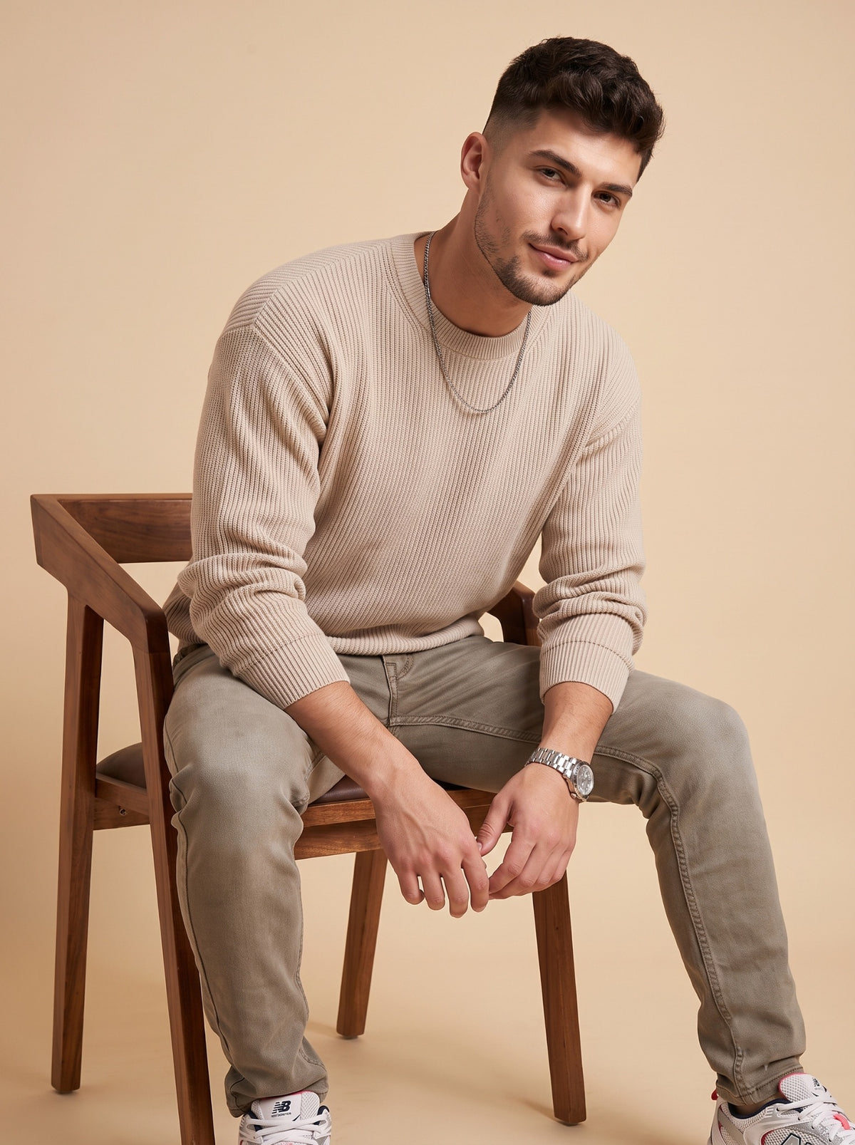 Men's taupe slim fit jeans seated front view