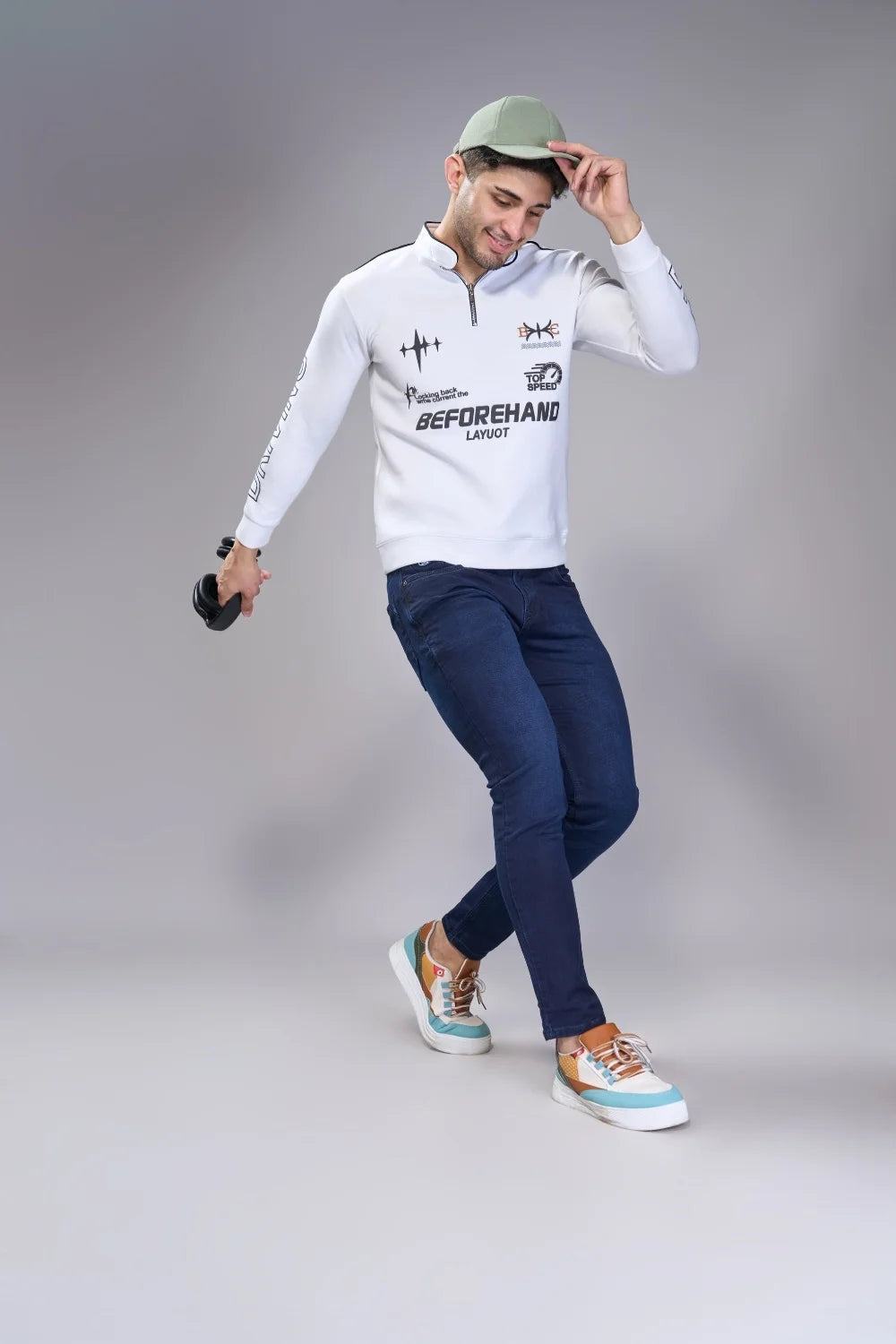 Movement-focused shot showing comfortable fit and natural drape of navy ankle-length denim