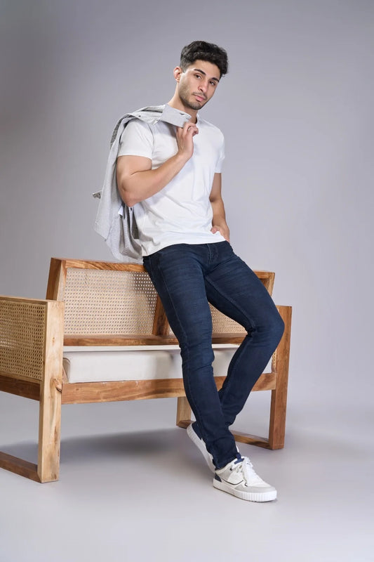 model showing dark blue jeans for men in regular fit styling pose