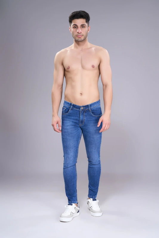 Evening outfit showing tapered denim with boots for a refined finish