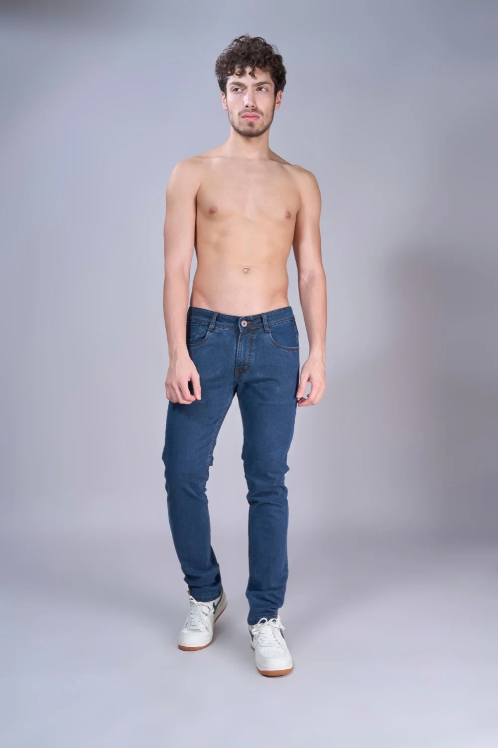 Indigo jeans displayed in full view showcasing color and structure
