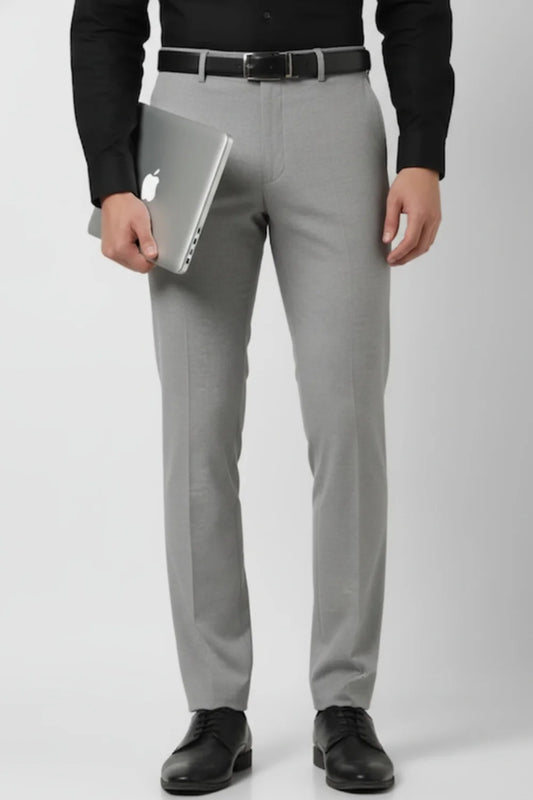 Detailed view of men’s grey ankle-length formal trousers