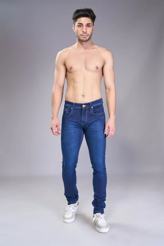 Man wearing blue regular fit denim jeans in a stylish standing pose