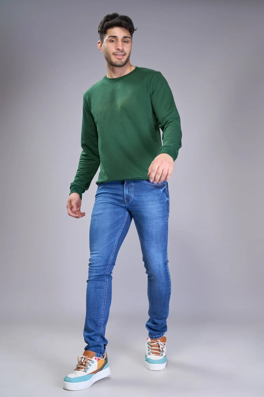 Walking pose showcasing premium navy blue jeans for men