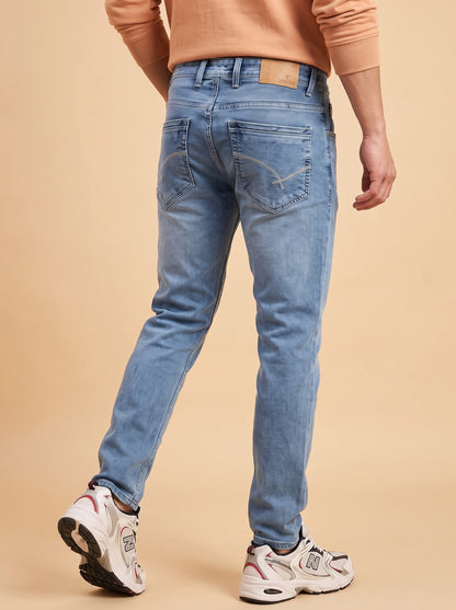 Men's light blue slim fit jeans back view