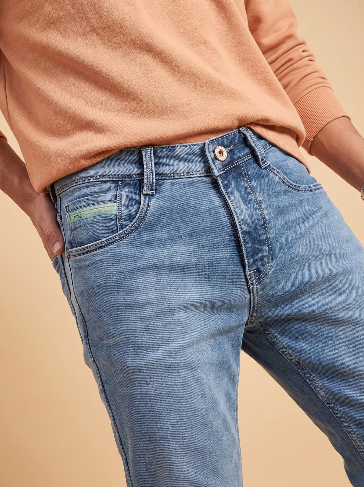 Light blue washed denim pocket and stitching detail