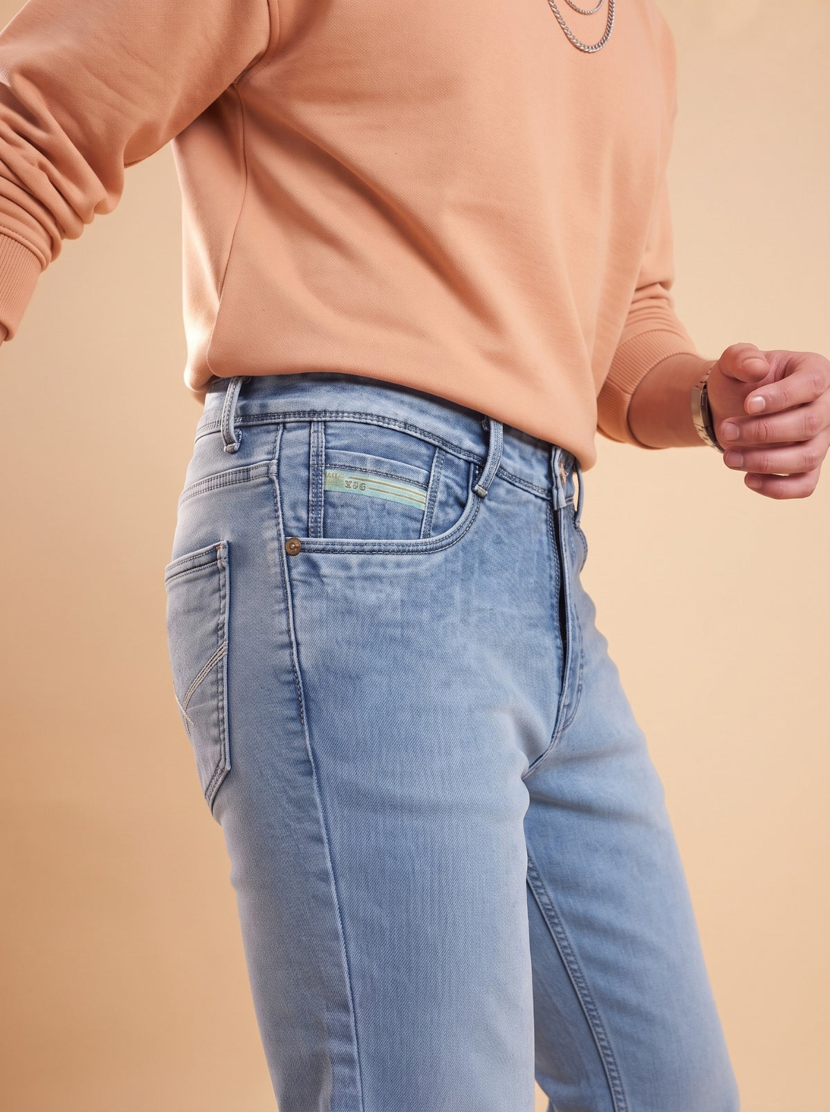 Light blue slim fit jeans side pocket close-up