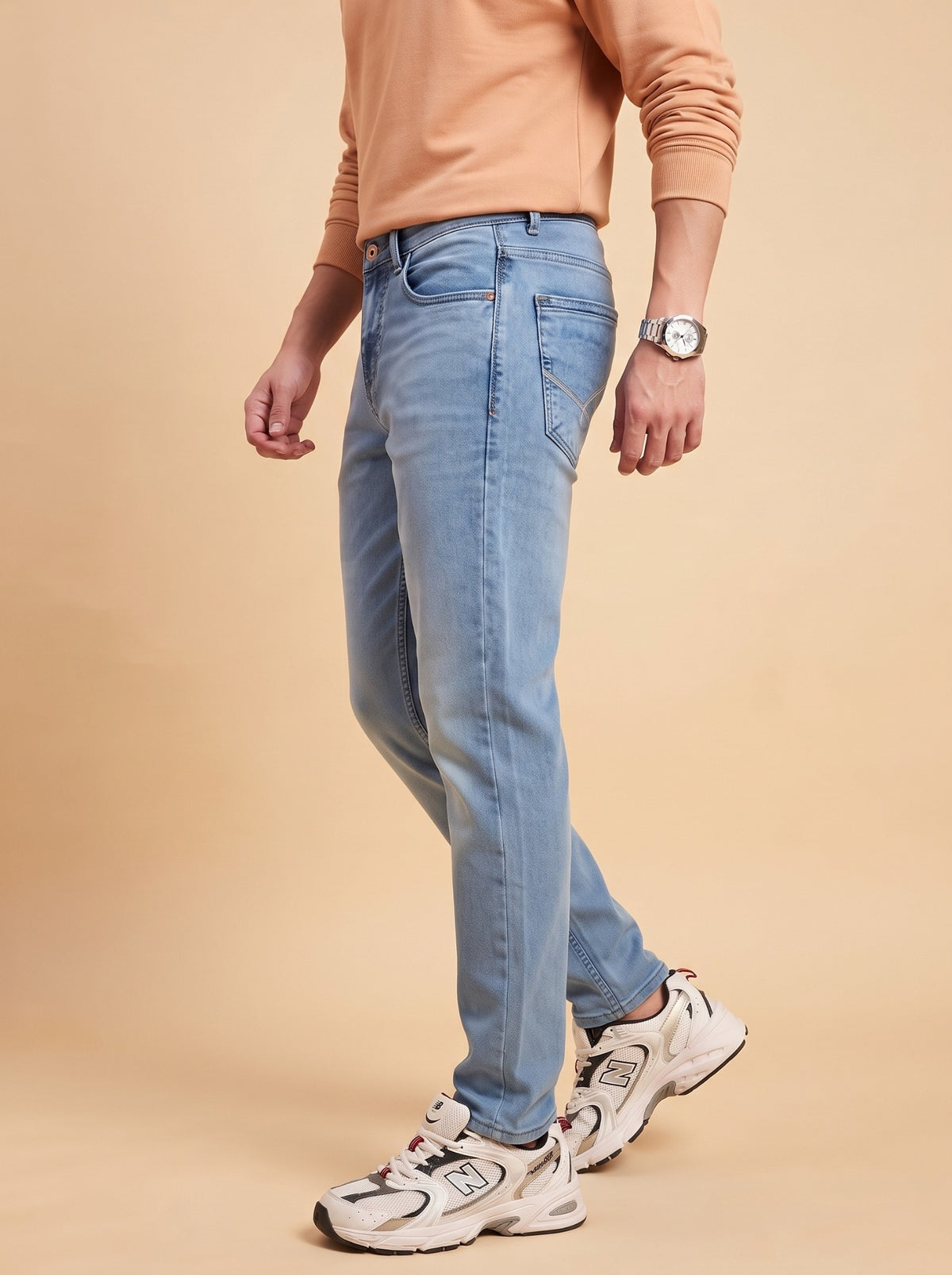 Men's light blue washed jeans side view