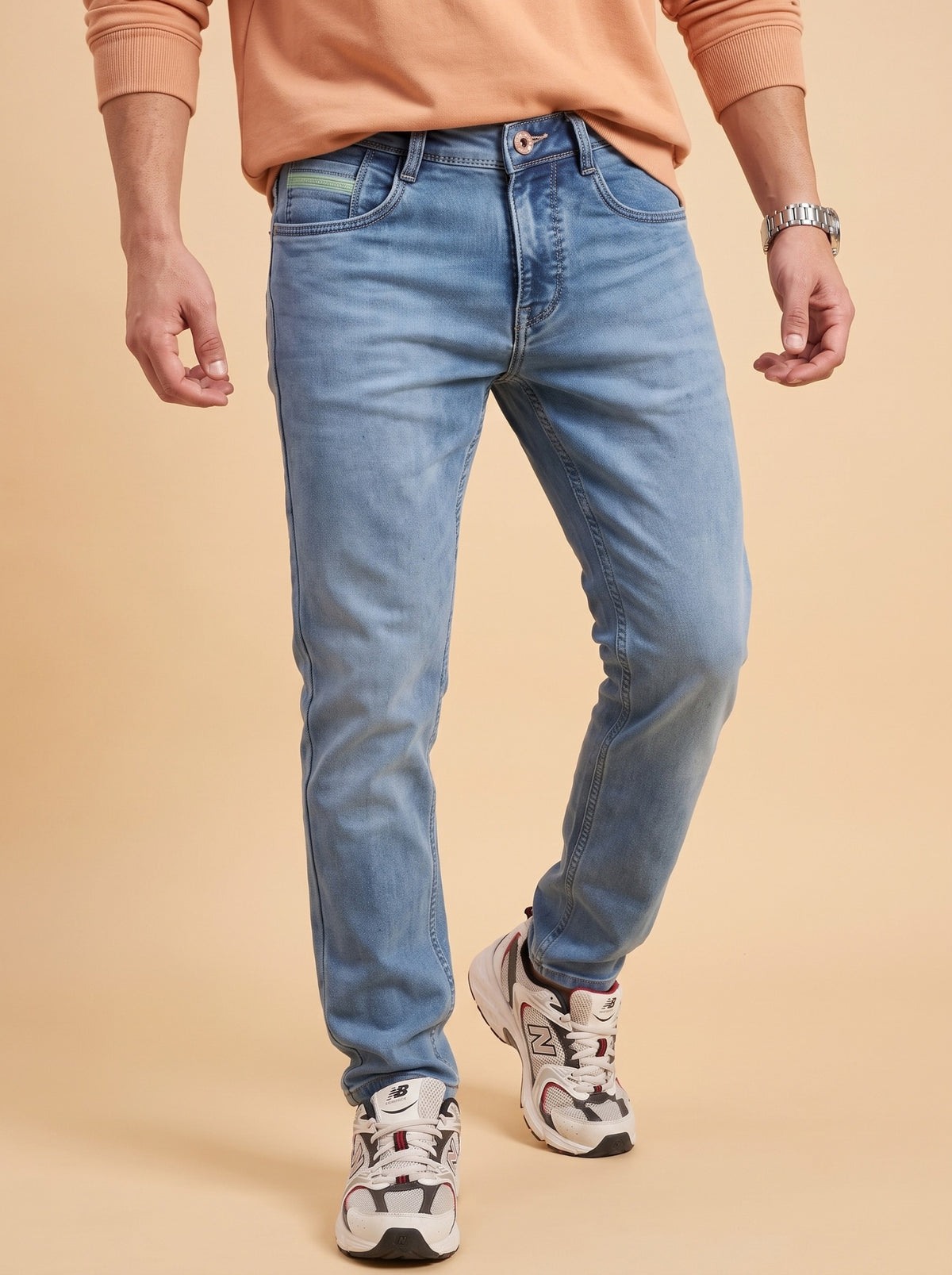 Men wearing light blue slim fit stretch jeans while walking
