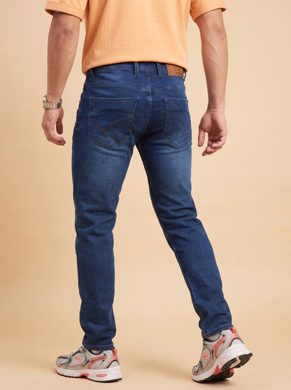 Men's dark indigo slim fit jeans back view