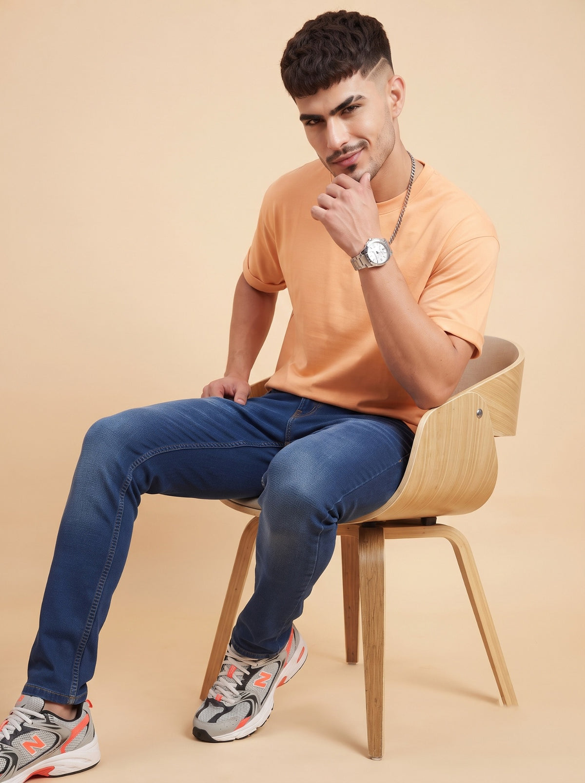 Men's dark indigo stretch jeans seated angle