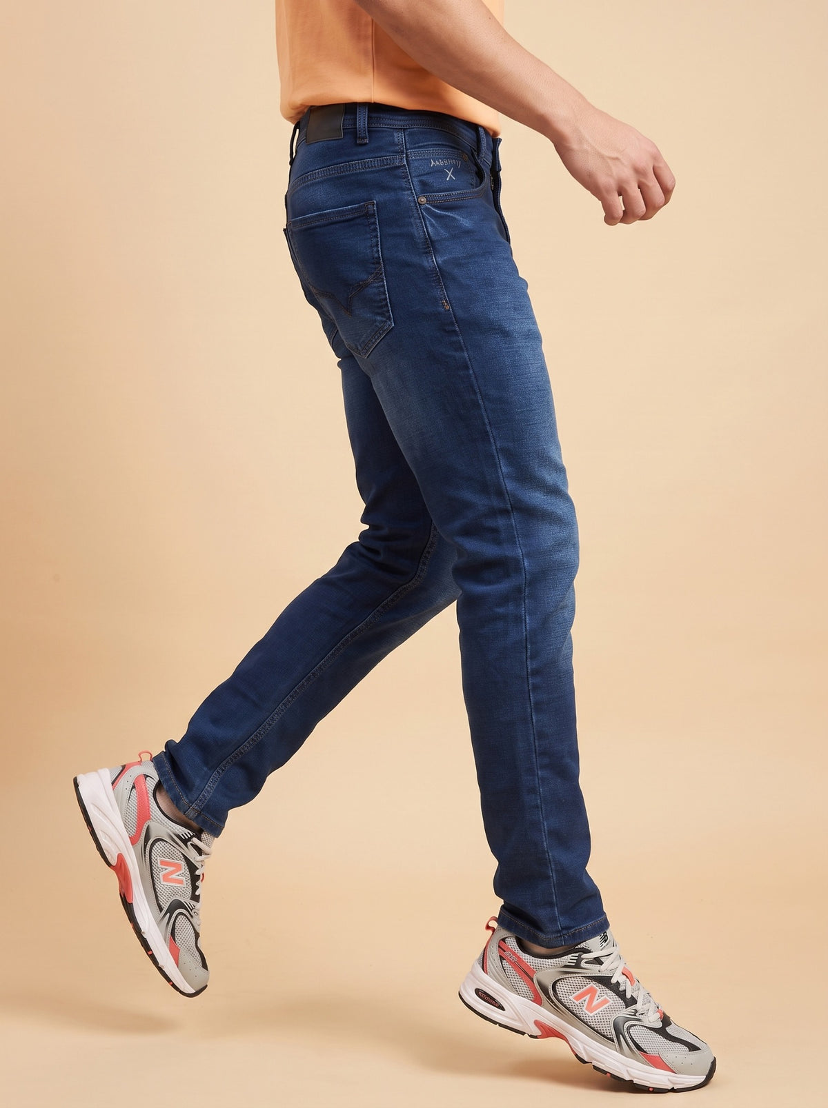 Men's dark indigo slim fit jeans side view