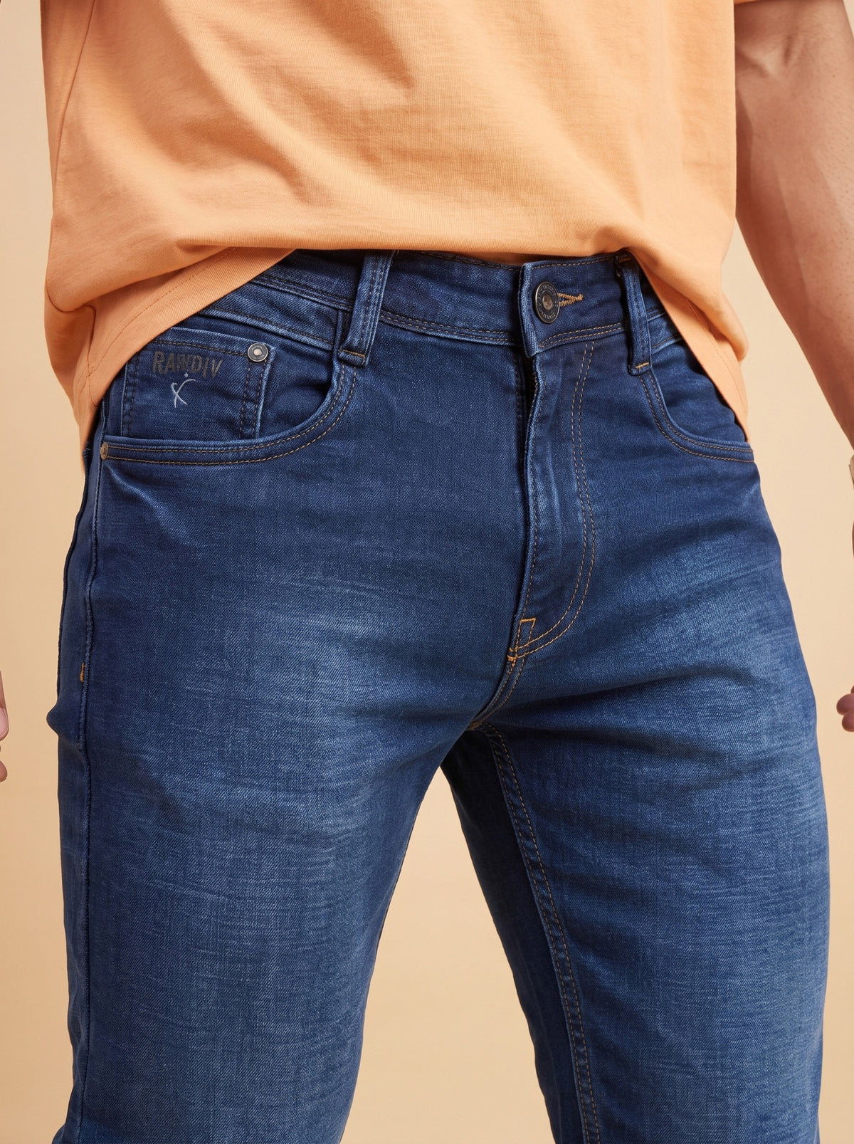 Dark indigo slim fit jeans waist close-up