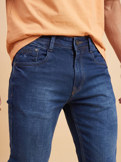 Dark indigo slim fit jeans waist close-up