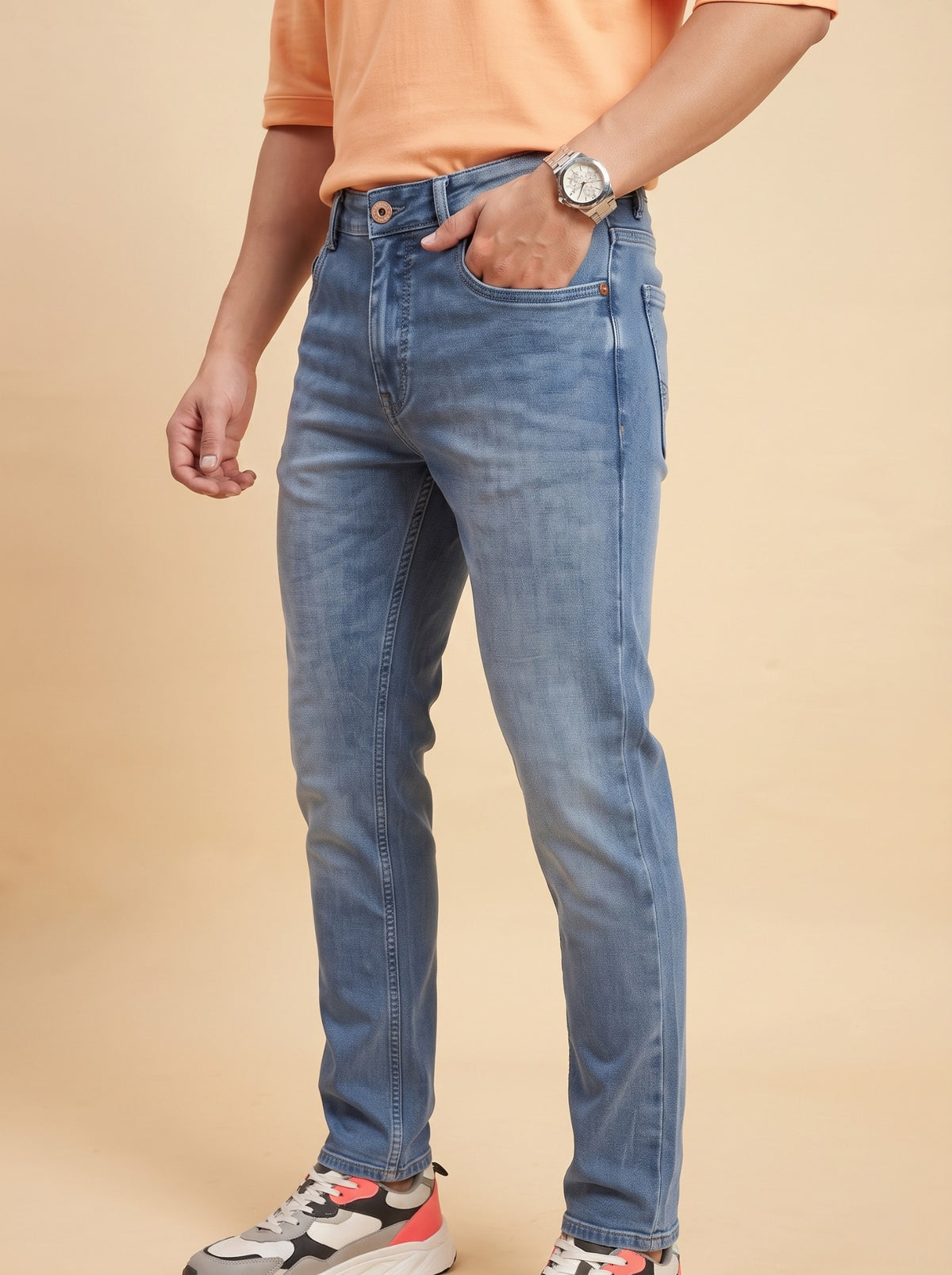 Men's mid-blue slim fit jeans angled view