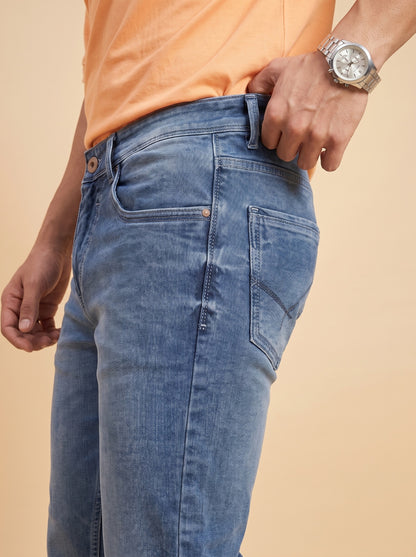 Mid-blue jeans rear pocket close-up