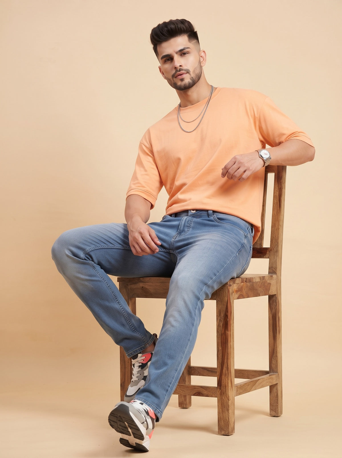 Men's mid-blue stretch jeans seated comfort view