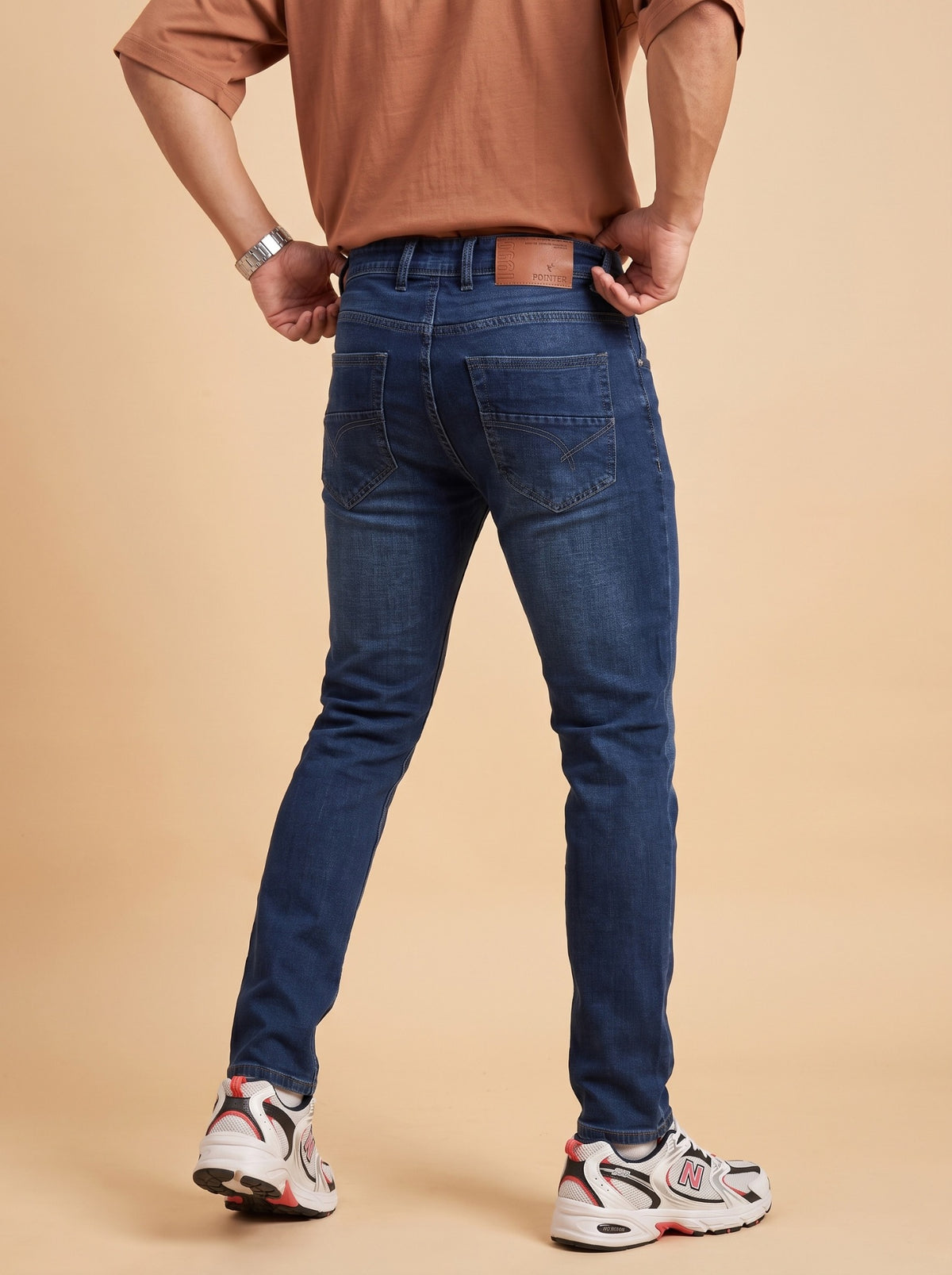 Men's deep blue slim fit jeans back view