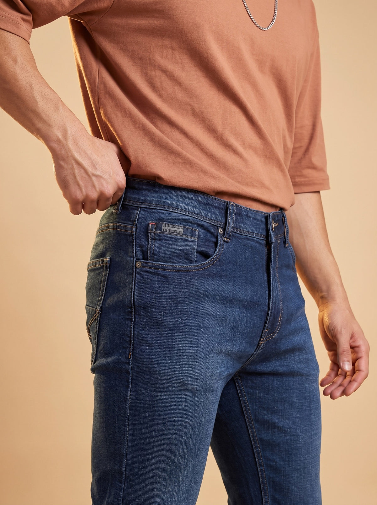 Deep blue slim fit jeans front pocket angle