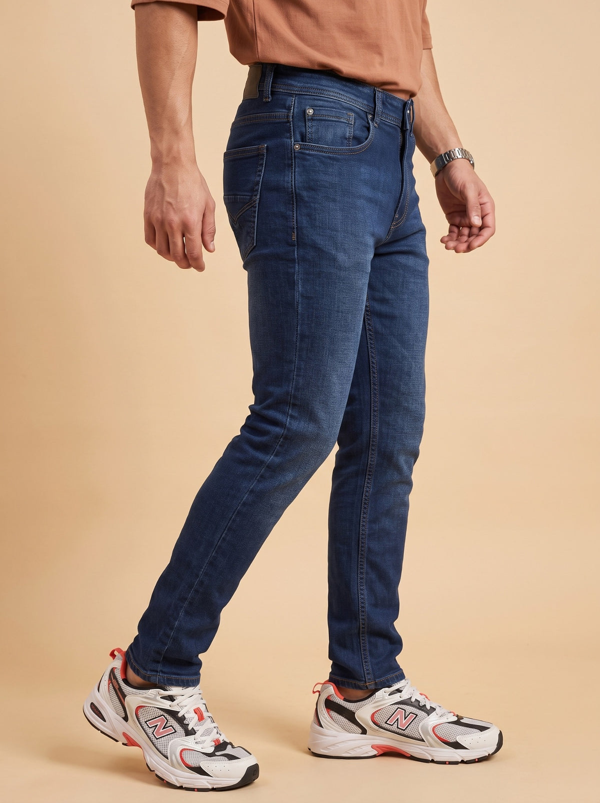 Men's deep blue slim fit jeans side view
