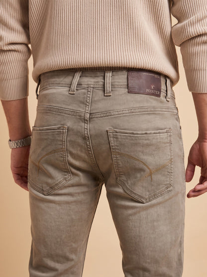 Taupe grey jeans rear pockets and waistband detail
