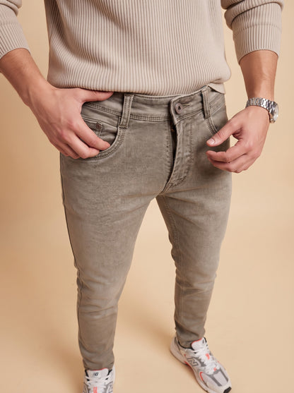 Taupe grey jeans front pocket and waistband detail