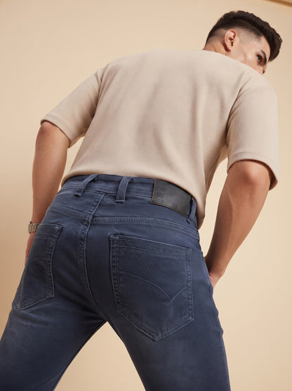 Men's steel blue slim fit jeans back view