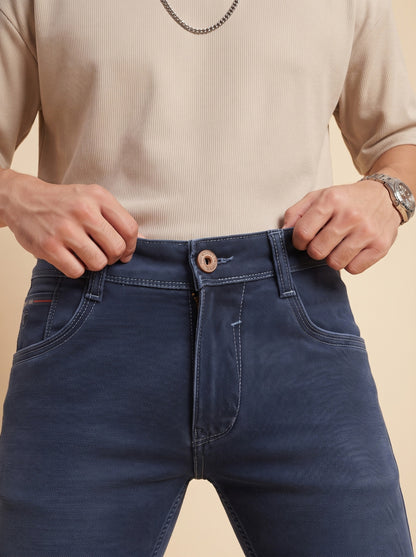 Steel blue jeans button and fly detail