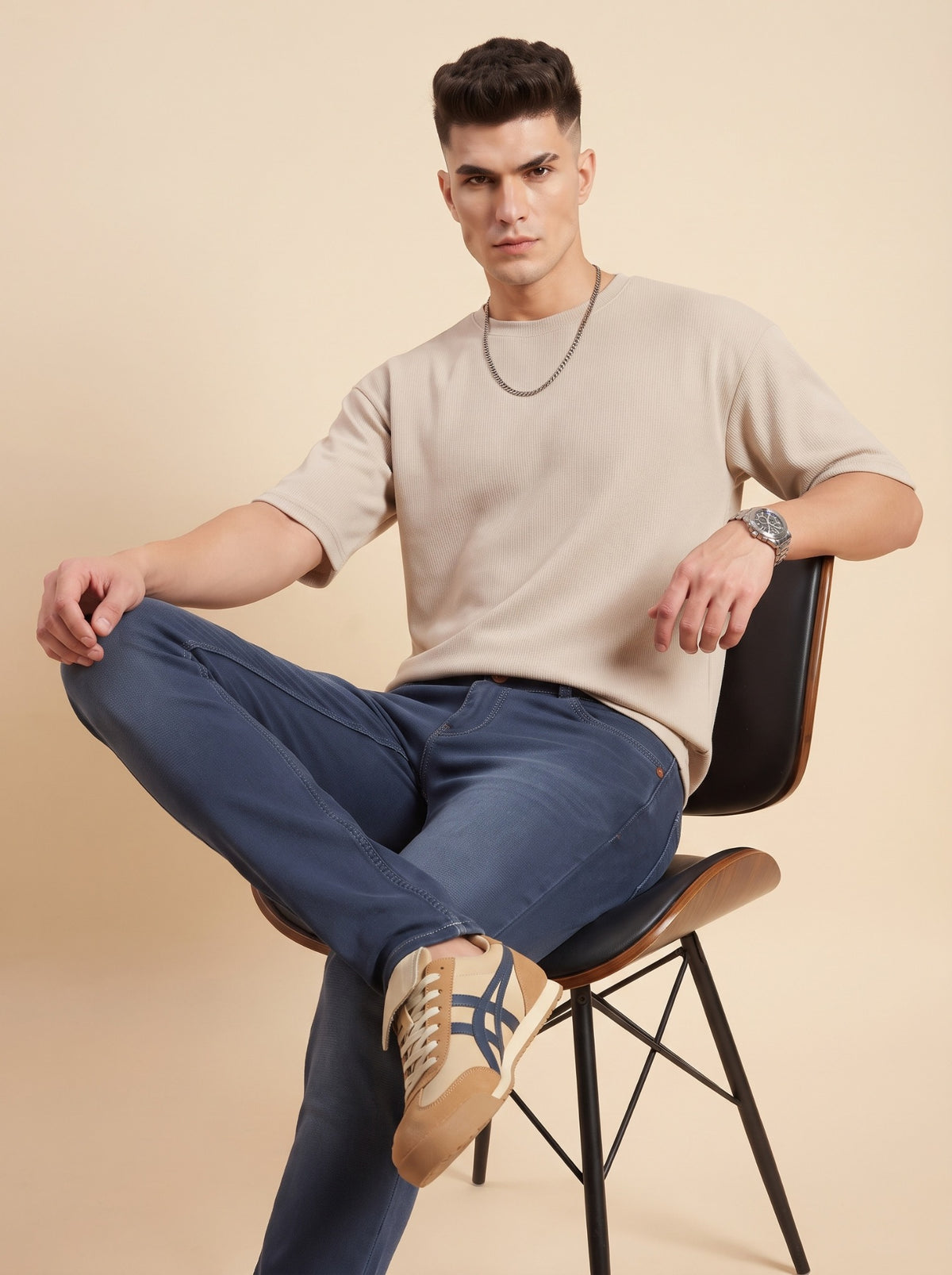 Men's steel blue slim fit jeans seated view