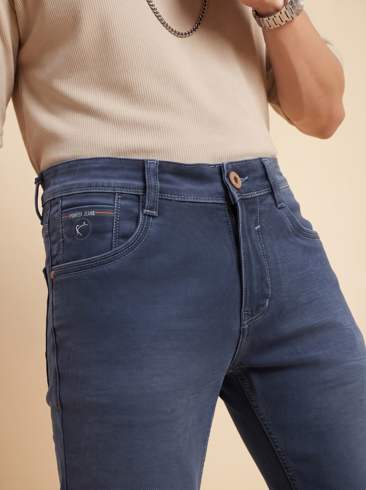 Steel blue jeans waistband close-up