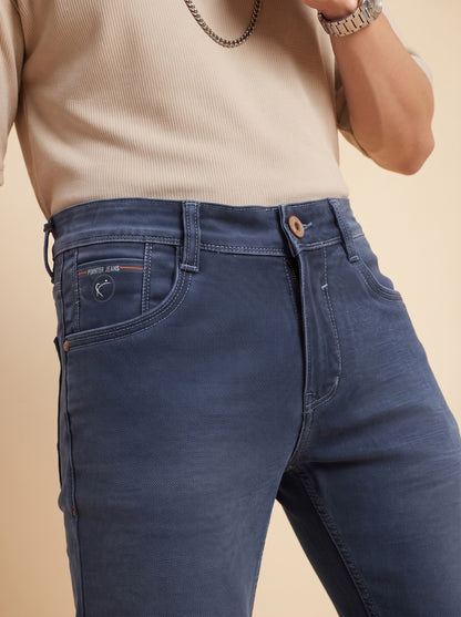 Steel blue jeans waistband close-up