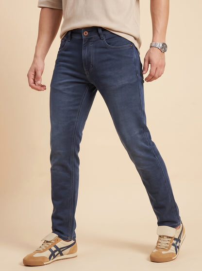Men wearing steel blue slim fit jeans while walking