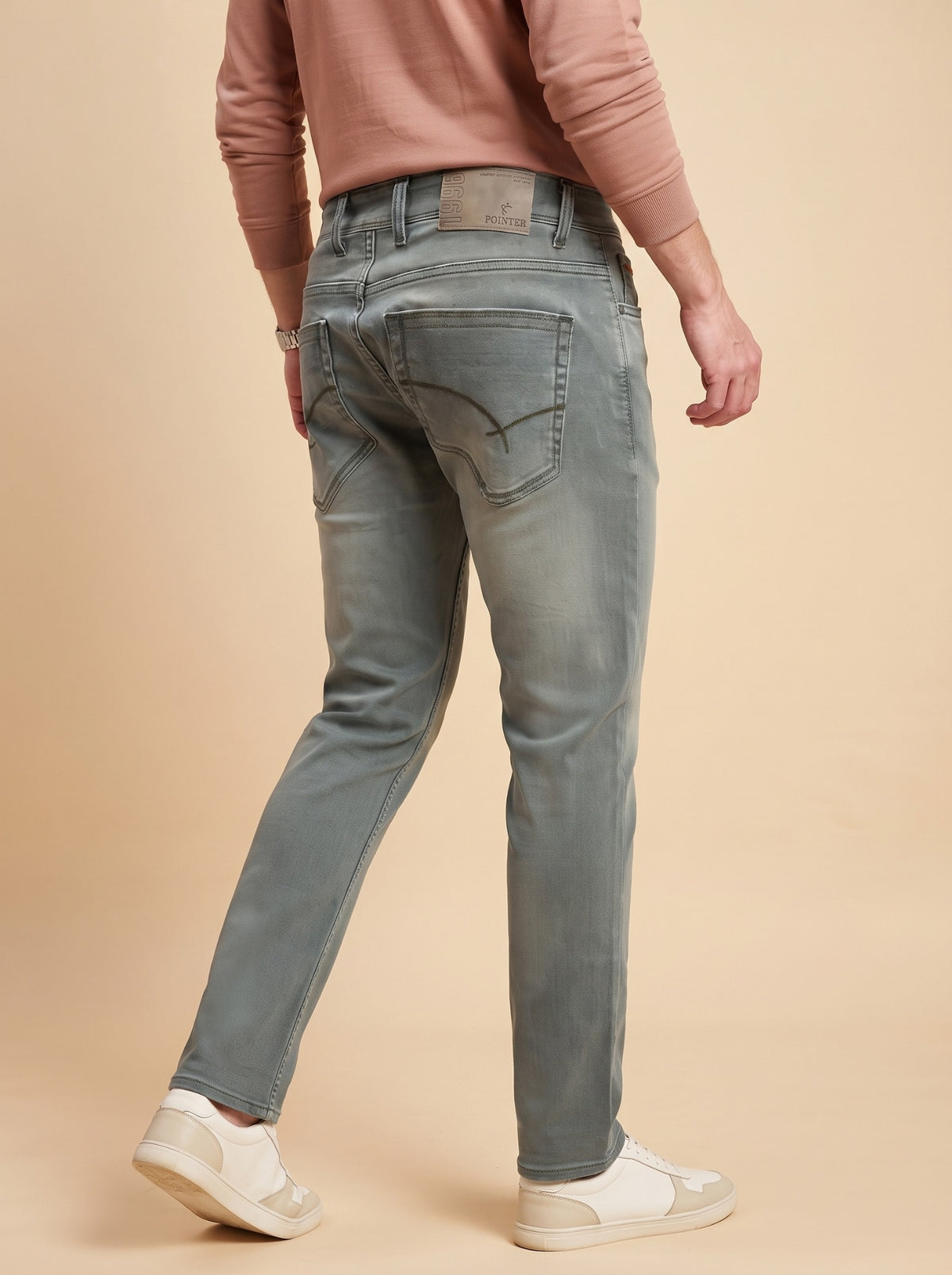 Men's sage grey slim fit jeans rear walking view