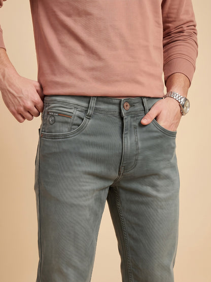 Sage grey jeans front pocket detail