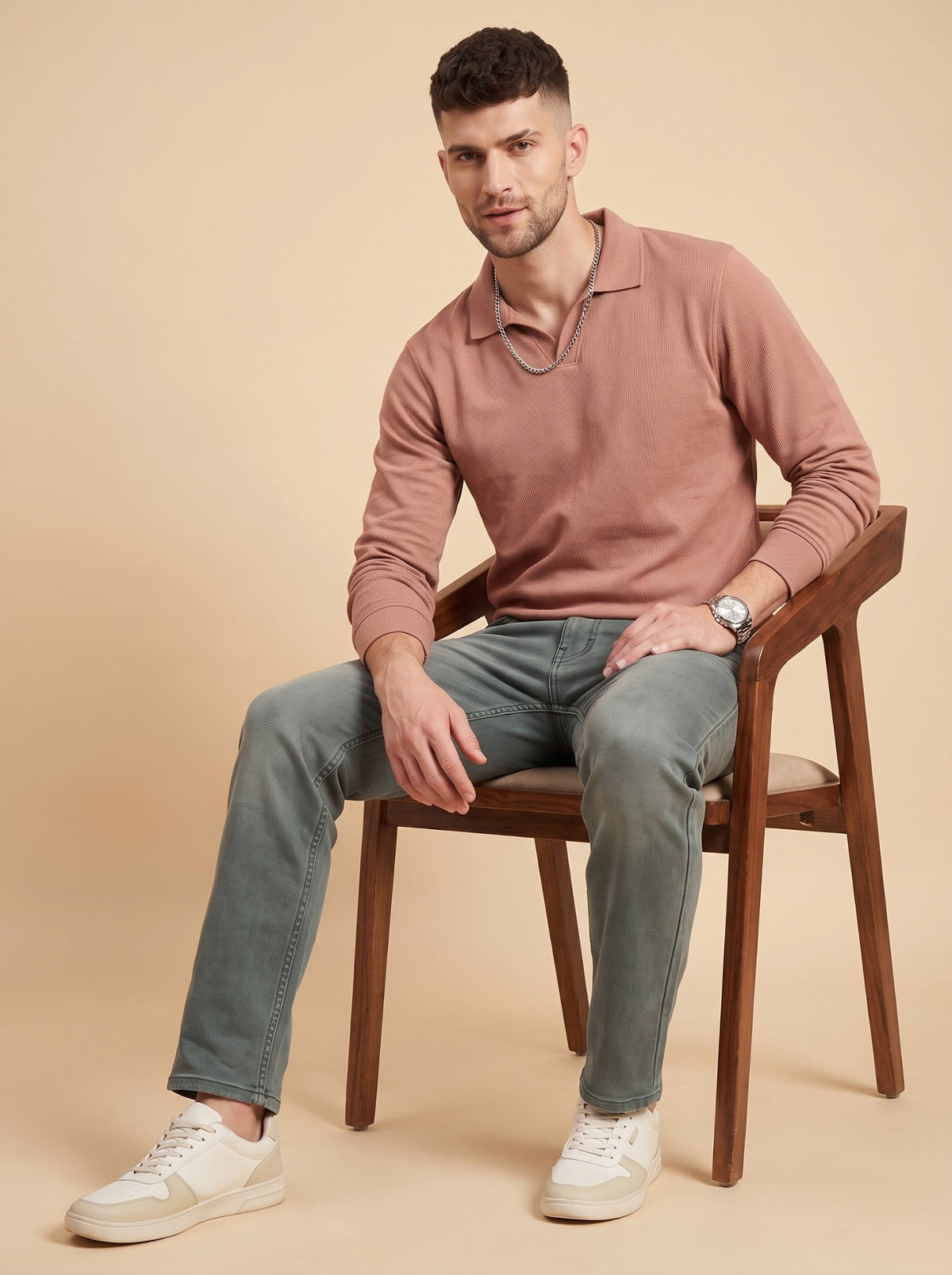 Men's sage grey slim fit jeans seated full view