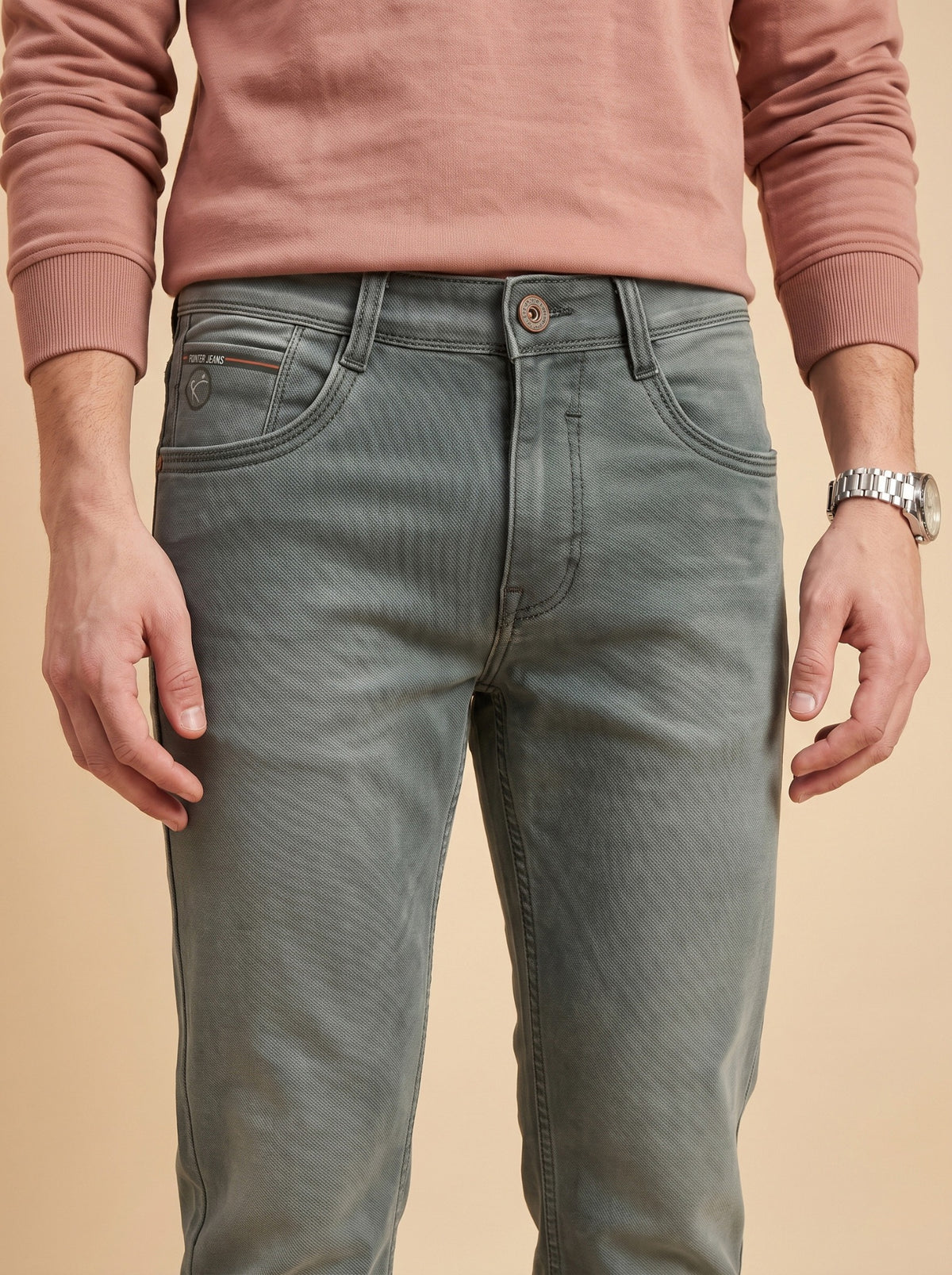 Sage grey slim fit jeans waist close-up