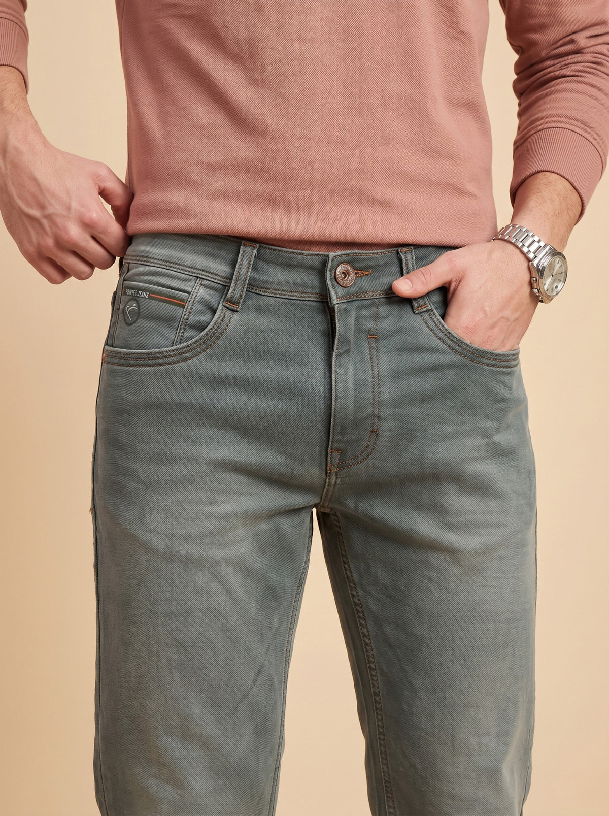 Sage grey jeans waistband and pocket detail