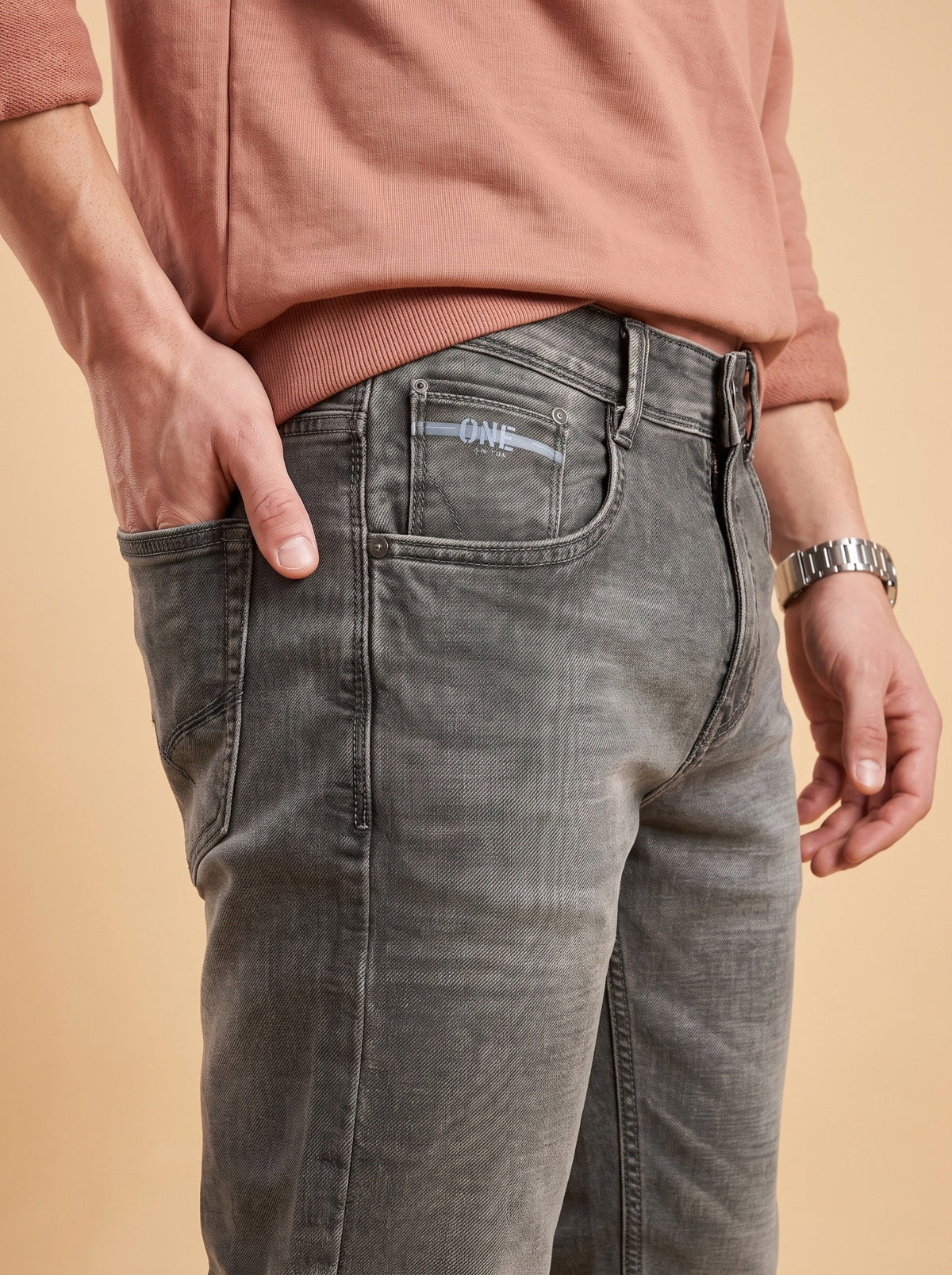 Charcoal grey jeans front pocket detail