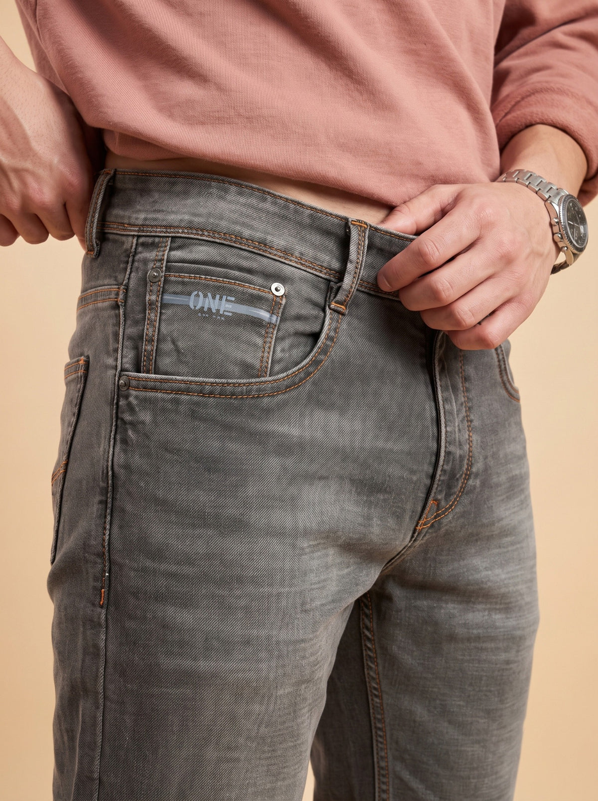 Charcoal grey slim fit jeans waistband close-up