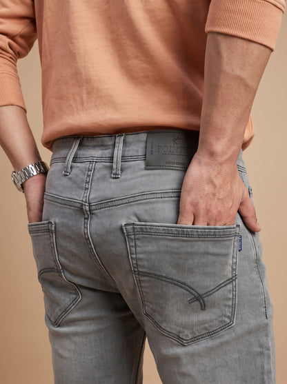Light grey jeans rear pocket and waistband detail