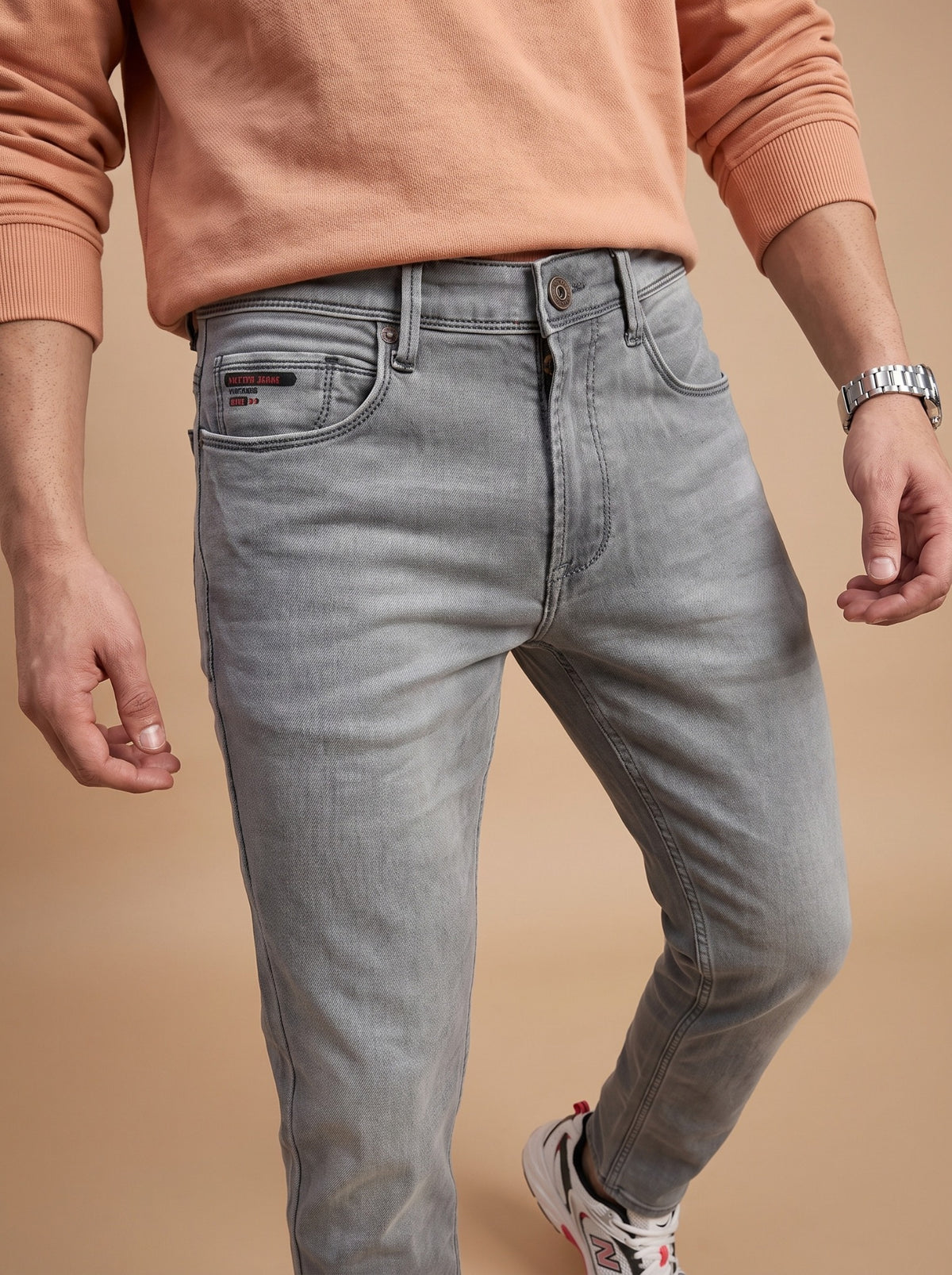 Light grey jeans front pocket detail