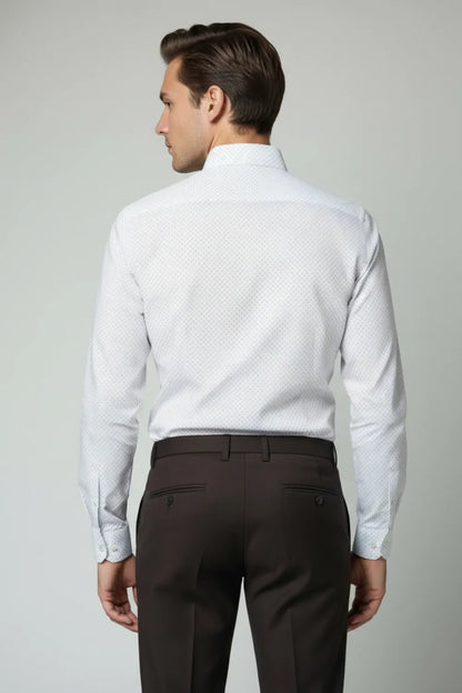 Man wearing a white dress shirt and dark brown formal pant against a plain background back side view