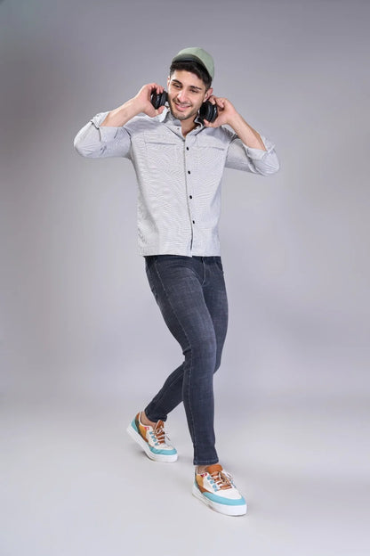 Evening outfit pairing showing ankle-focused jean silhouette
