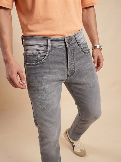 Ash grey men's jeans showing front fit and washed denim finish