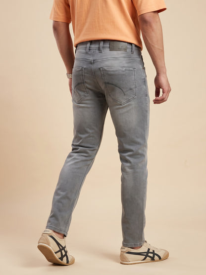 Ash grey straight fit jeans for men, rear walking view