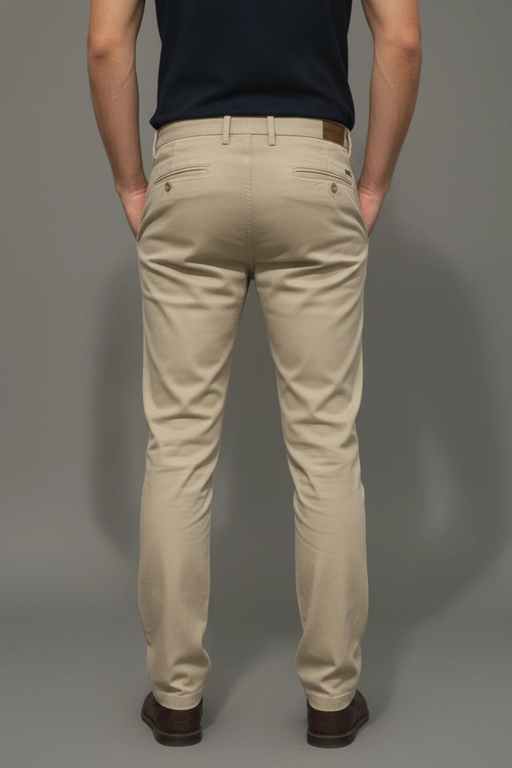 Showing the professional overlock stitching backside the beige trouser leg