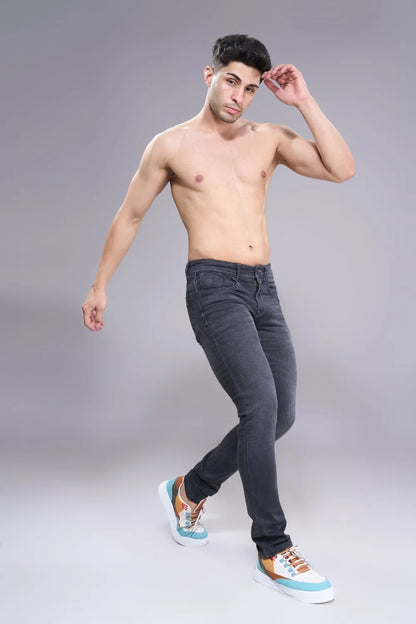 Stretch test of black regular fit jeans showing comfort and flexibility
