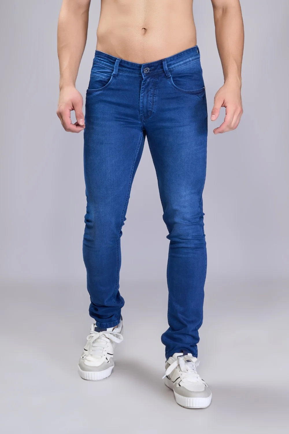 Premium blue denim fabric texture of men’s regular fit jeans.
