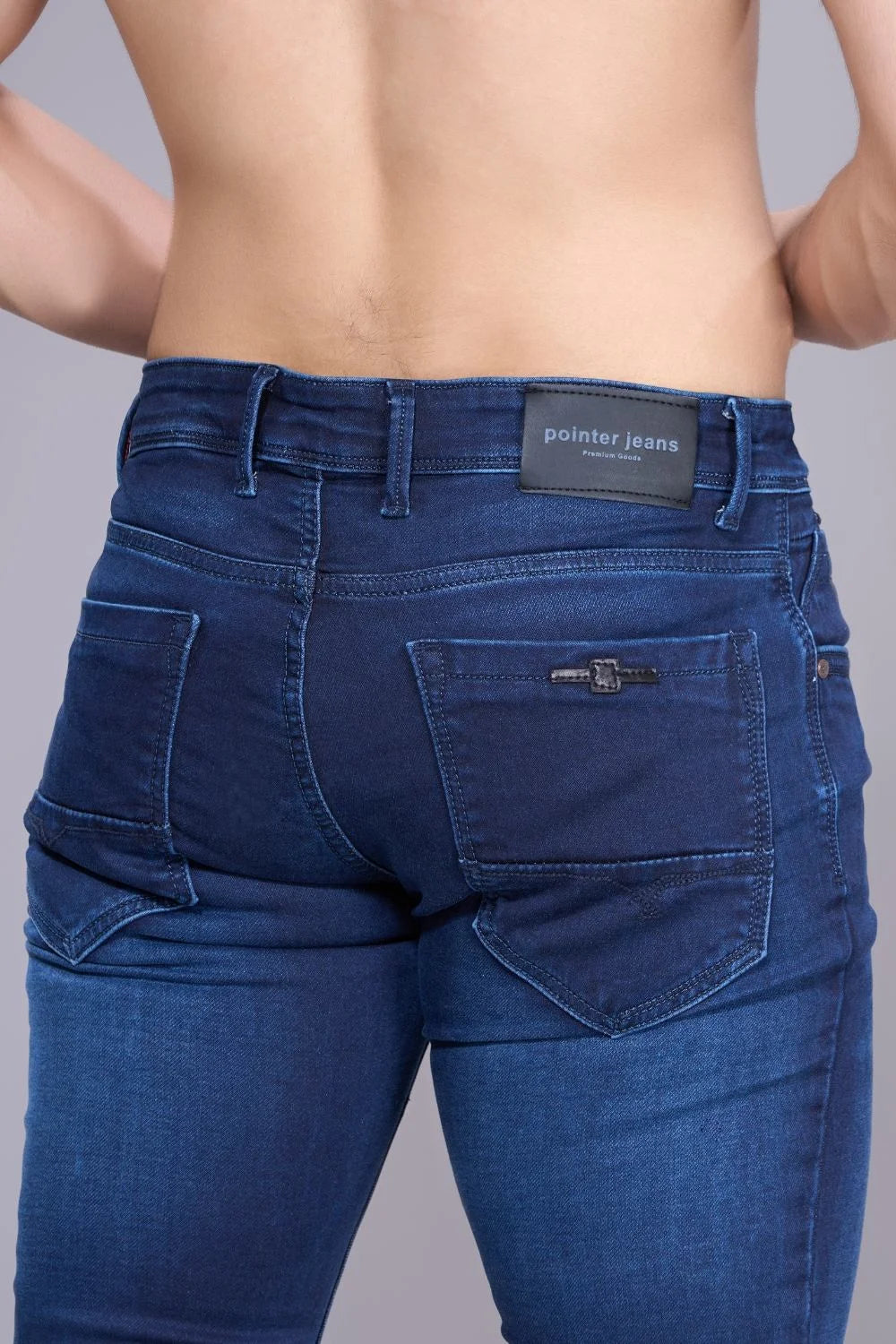 Back view of blue regular fit jeans for men displaying pockets and straight fit.
