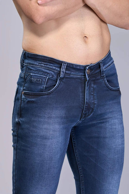 Close-up of Oxford Blue ankle jeans fabric and stitching for boys
